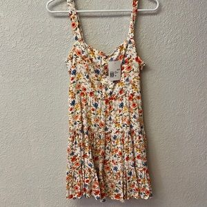 medium floral print dress. no tears or any damage. new with tags